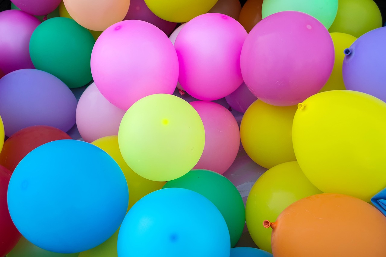 Assorted latex balloons in bright colours