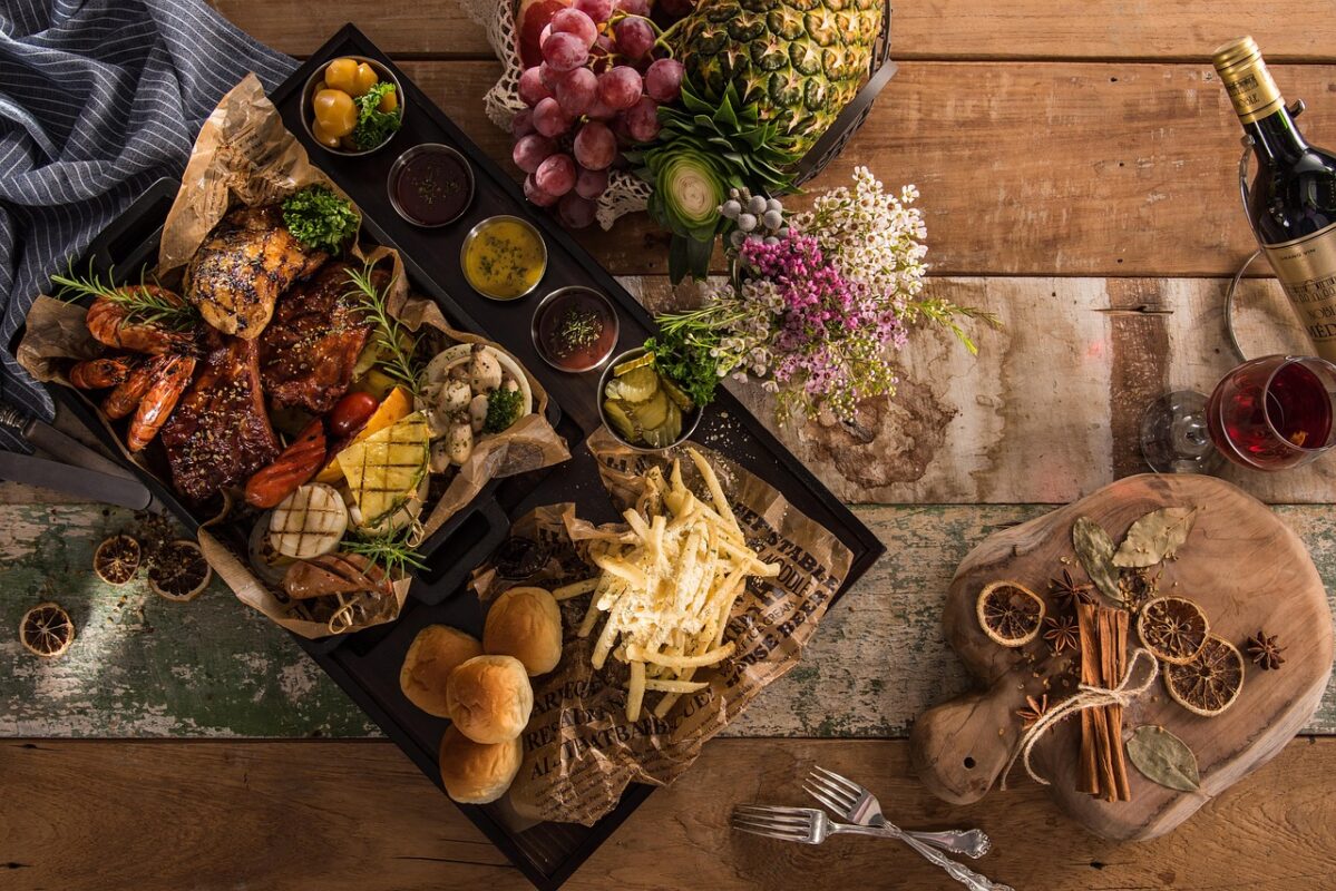 A buffet line with covered serving trays